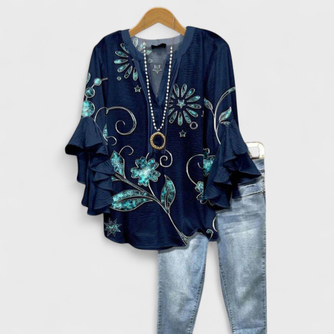 Chic women's ruffle-sleeve V-neck blouse with a vibrant floral print, perfect for lightweight summer fashion.