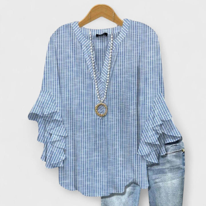 Elegant women's V-neck blouse with floral print and ruffle sleeves, a versatile top for casual or dressed-up looks.