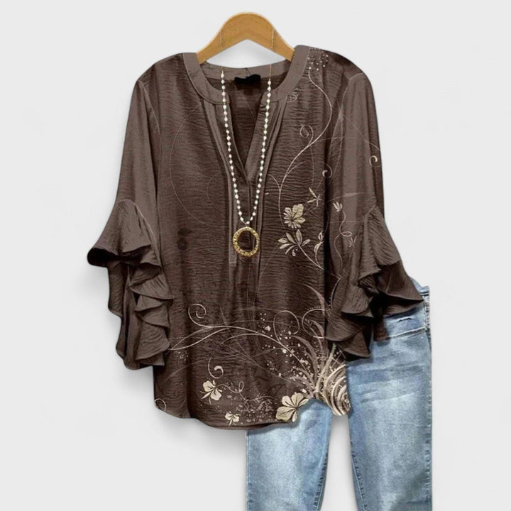 Stylish women's floral print top, a lightweight V-neck blouse with charming ruffle sleeves for summer fashion.