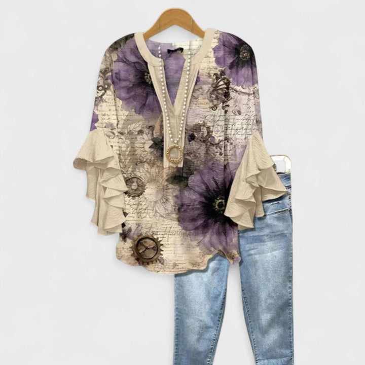 Casual chic women's floral print V-neck blouse with fluttery ruffle sleeves, great for versatile everyday wear.