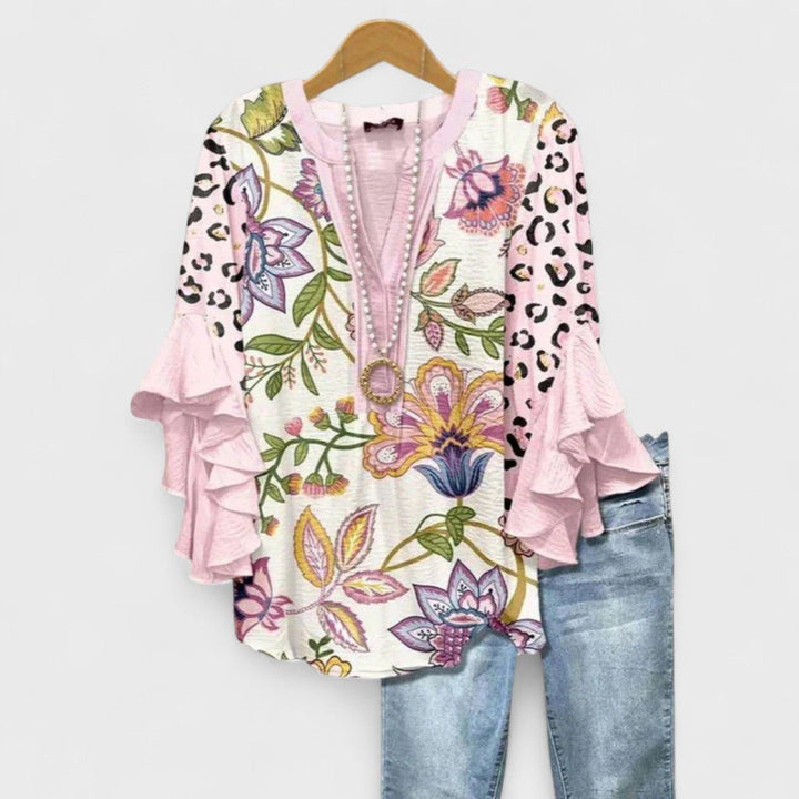 Beautiful women's floral print V-neck blouse featuring graceful ruffle sleeves, a lightweight top for any day.