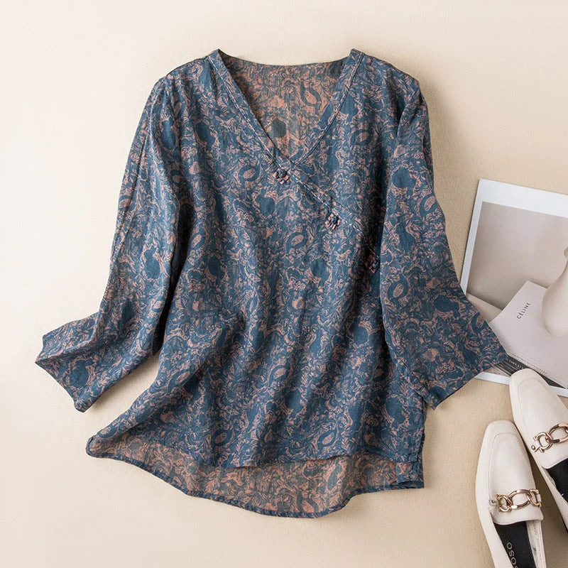 Women's floral print V-neck shirt with 3/4 sleeves, ideal for summer casual style.