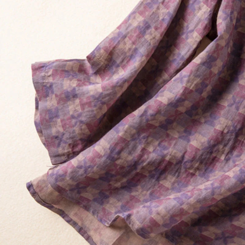 Close-up of vibrant floral print on a women's V-neck shirt with comfortable 3/4 sleeves.