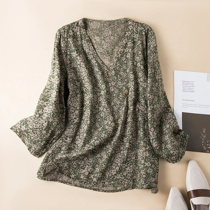 Stylish woman wearing a casual floral V-neck 3/4 sleeve shirt, perfect for summer outings.