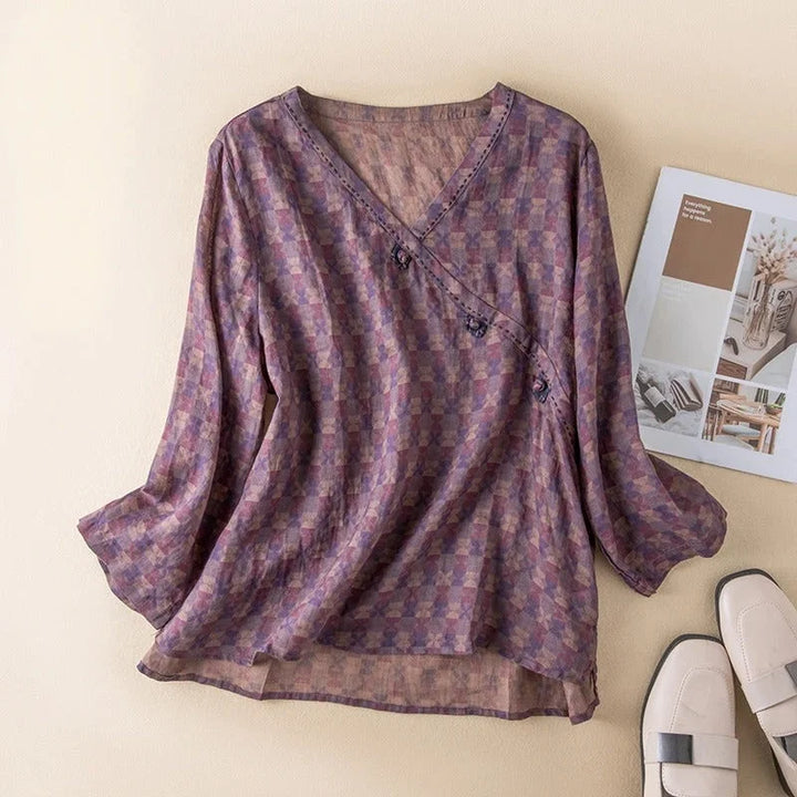 Elegant floral print women's V-neck shirt with fashionable 3/4 sleeves, a versatile blouse.