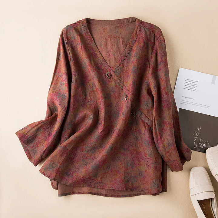 Relaxed fit women's floral V-neck shirt with practical 3/4 sleeves for everyday casual wear.