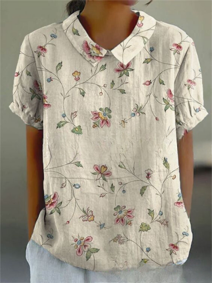Feminine casual blouse for women, featuring a stylish Peter Pan collar and a versatile short sleeve design.