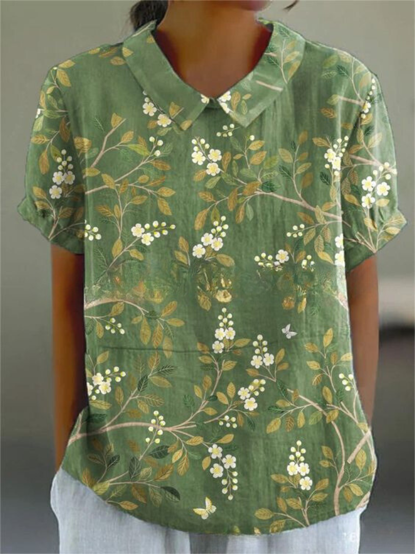 Summer fashion women's printed top with a classic Peter Pan collar & comfortable short sleeves.