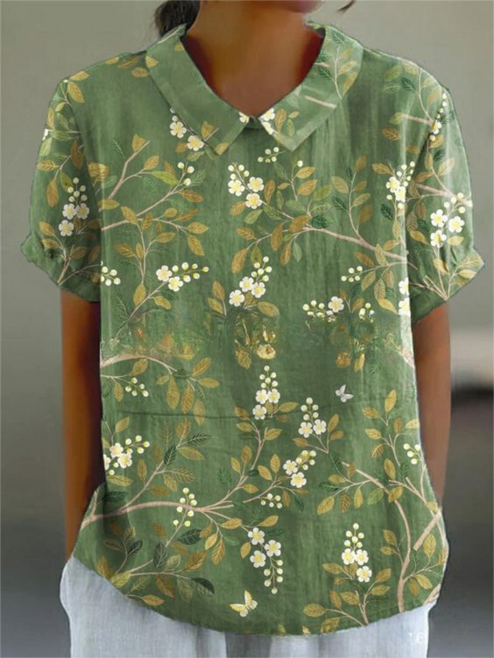 Summer fashion women's printed top with a classic Peter Pan collar & comfortable short sleeves.