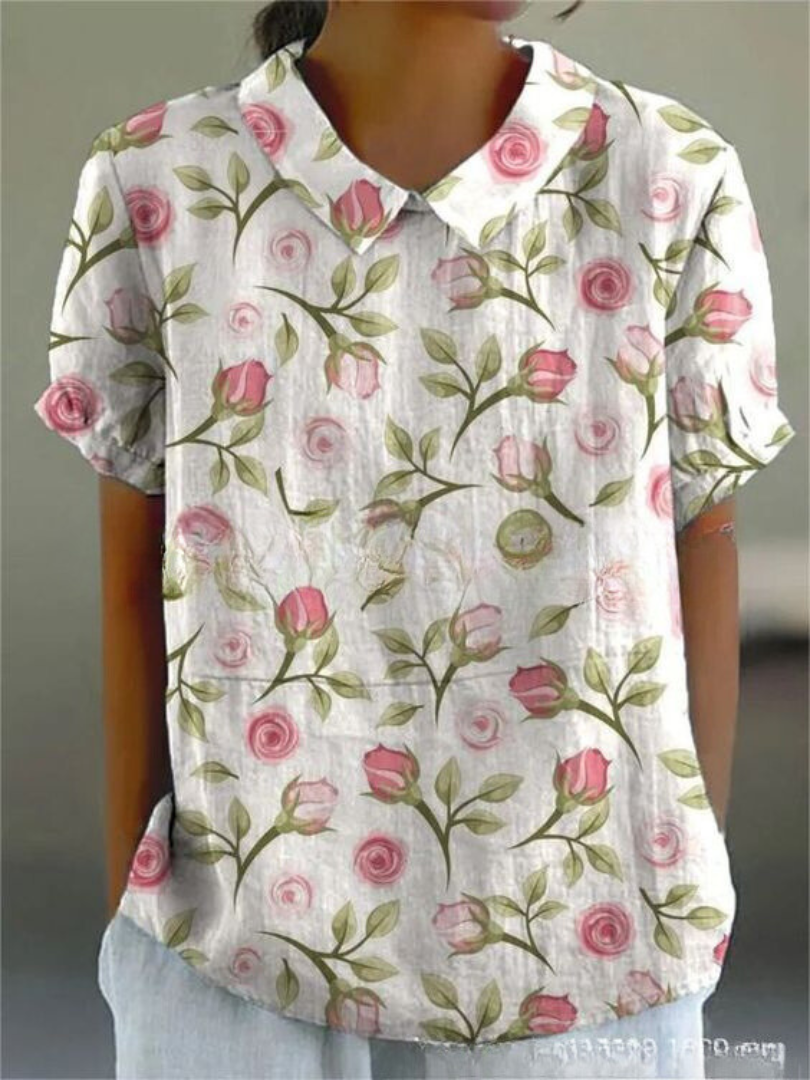 Chic women's short sleeve blouse with a distinctive Peter Pan collar and fashionable all-over print.