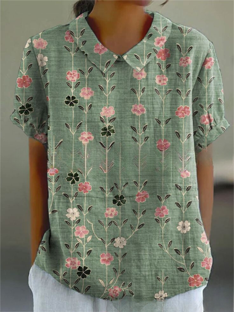 Stylish casual women's blouse, short sleeve, with a unique Peter Pan collar and attractive print.