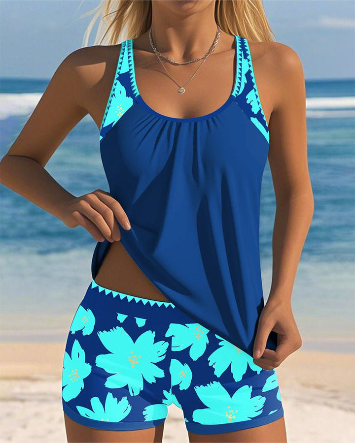 Comfortable women's tummy control tankini swimsuit featuring a stylish floral print and supportive racerback.