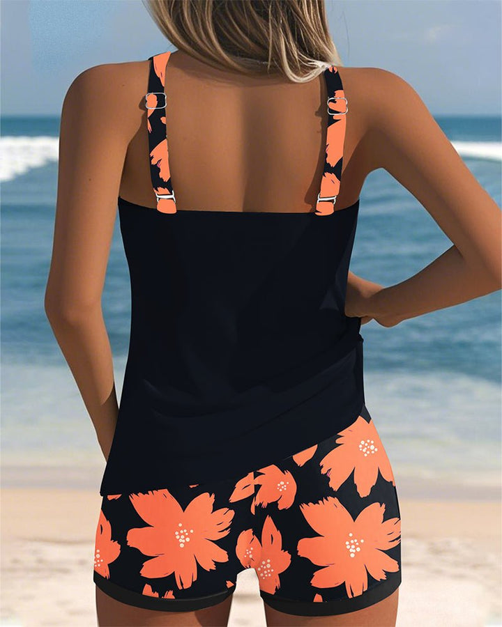 Summer-ready women's floral racerback tankini. Tummy control two-piece swimwear ideal for beach vacations.