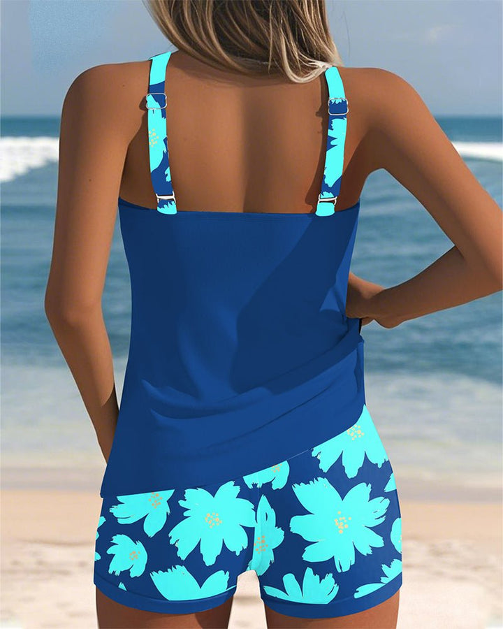 Close-up of women's floral racerback tankini top, showcasing tummy control and vibrant tropical print.
