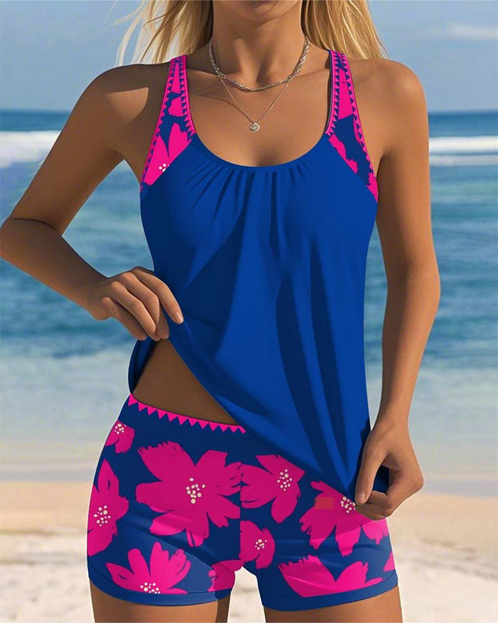 Women's two-piece floral tankini swimsuit. Tummy control bottoms paired with a stylish racerback top.