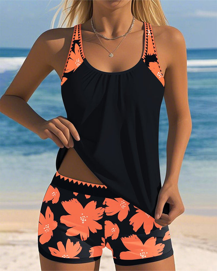 Trendy women's floral tummy control swimwear. Racerback tankini offers comfort and style for vacation.