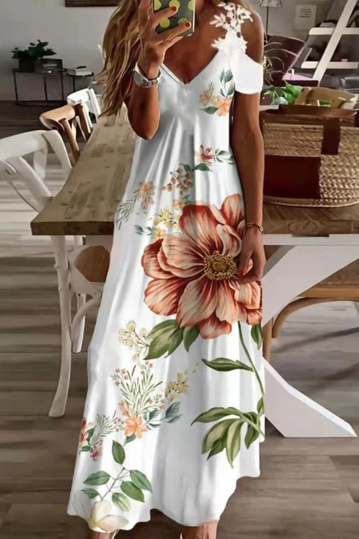 Elegant women's floral maxi dress featuring a sleeveless cold shoulder design, ideal for summer fashion.