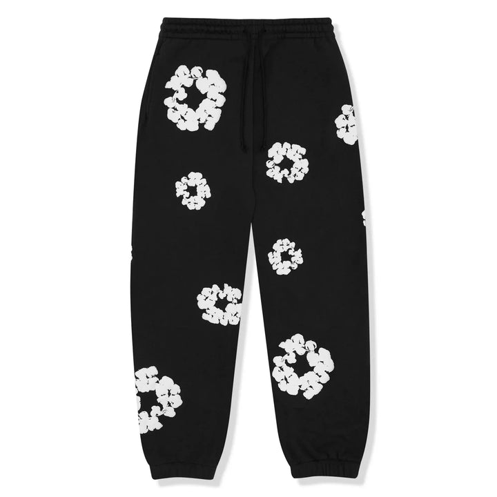 Cozy woman relaxing in a Floral Tears tracksuit set, perfect for comfortable loungewear.