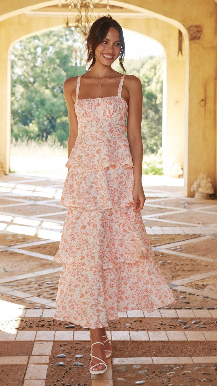 Women's floral tiered maxi dress, perfect for wedding guests. Elegant spring/summer formal wear.
