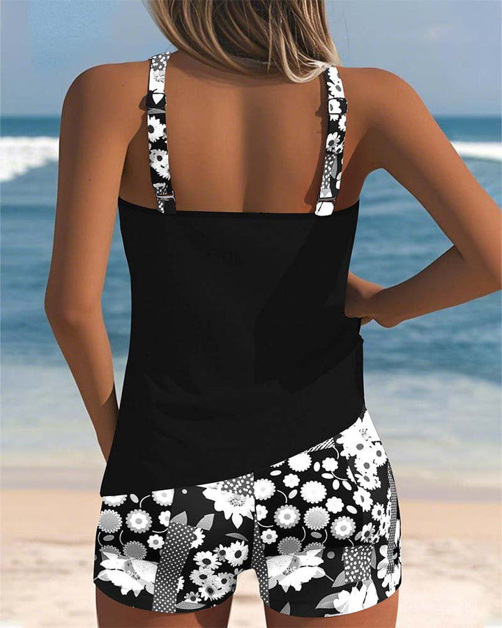Vacation-ready women's floral print two-piece bikini, essential comfortable swimwear for summer trips.