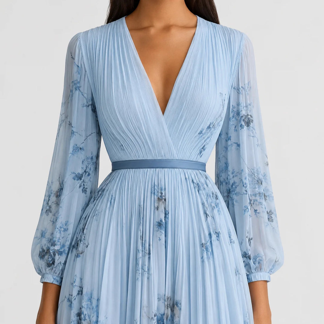 Elegant women's summer midi dress, floral print, V-neck and pleated details.
