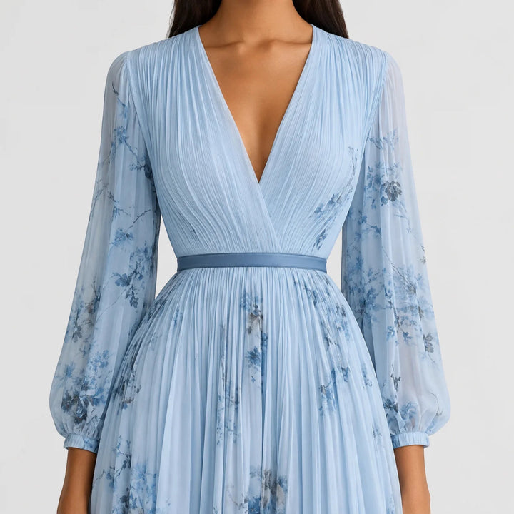 Elegant women's summer midi dress, floral print, V-neck and pleated details.