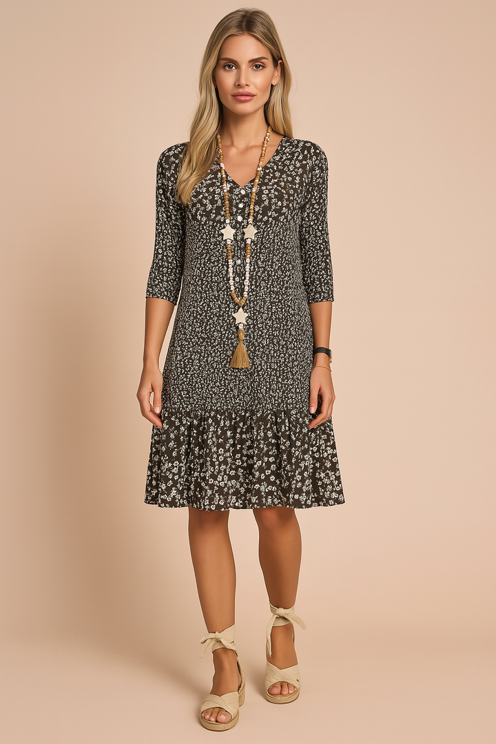 Comfortable women's floral V-neck boho dress. Ideal casual summer dress with 3/4 sleeves for elegant style.