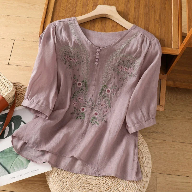 Stylish women's floral V-neck Henley blouse with 3/4-sleeves. Relaxed fit for casual or elegant spring/summer outfits.