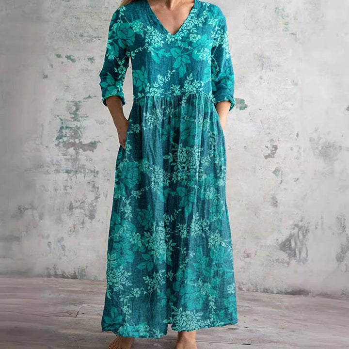 Fashionable floral print V-neck maxi dress for women, offering a relaxed fit for summer resort style.