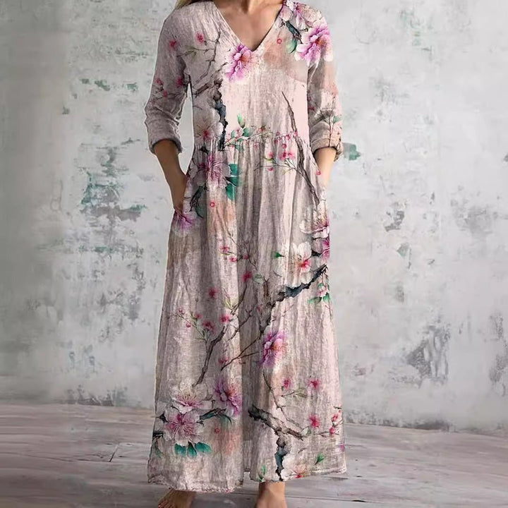 Elegant women's floral print V-neck maxi dress, comfortable and stylish for summer casual wear.