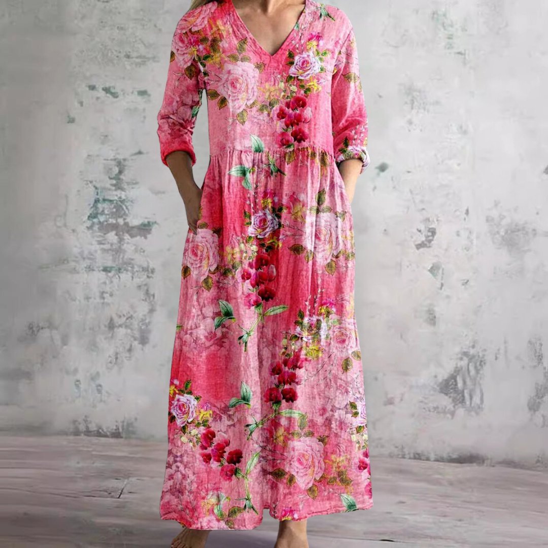 Flowy women's summer maxi dress with a vibrant floral print and flattering V-neckline.