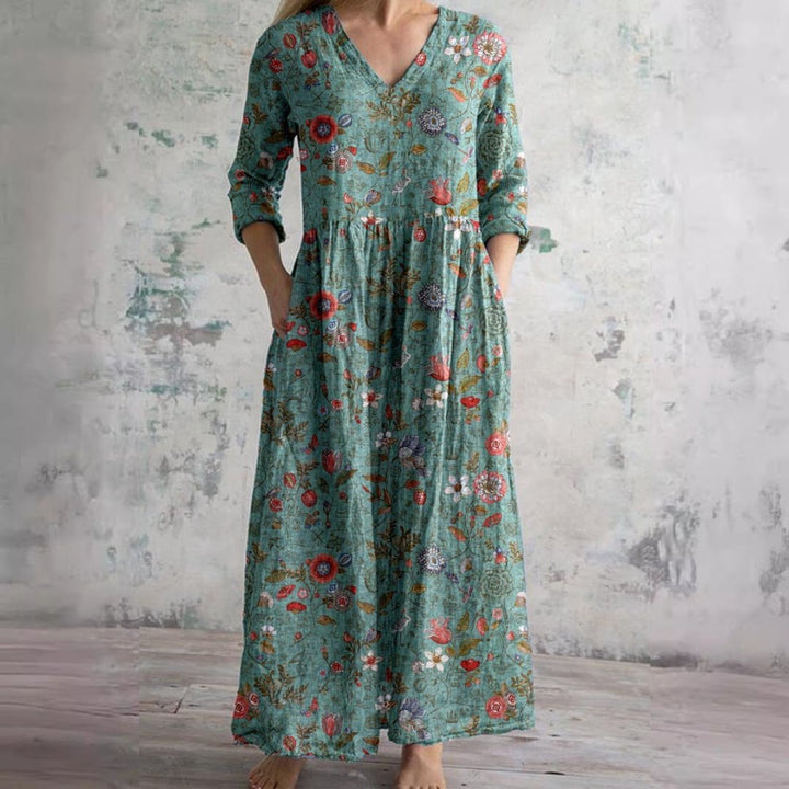 Floral V-neck maxi dress with three-quarter sleeves, a versatile piece for women's summer wardrobes.