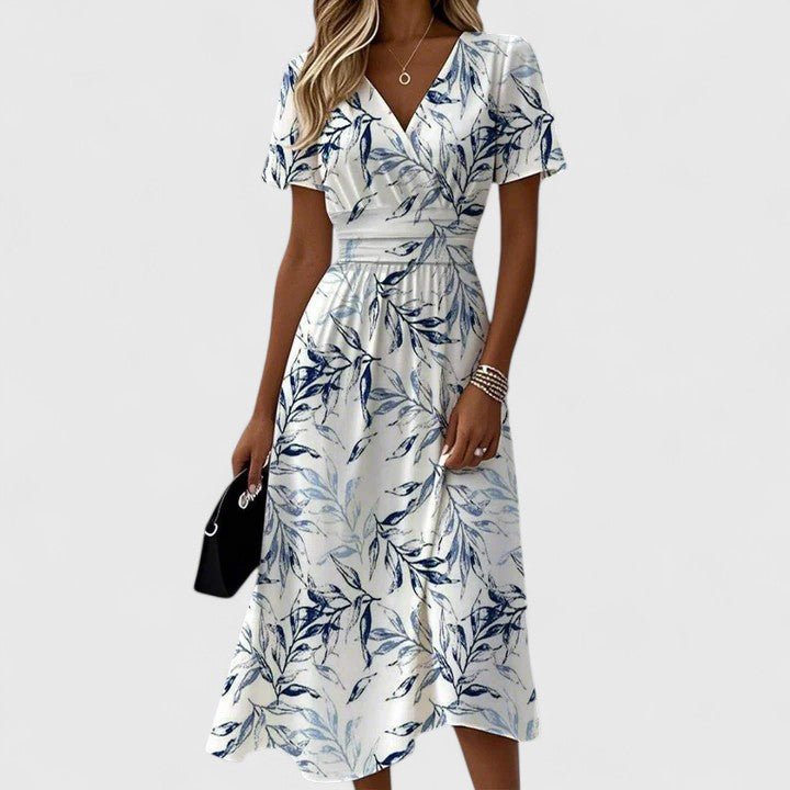 Women's floral wrap V-neck midi dress with flutter sleeves, perfect for summer garden parties or casual chic office wear.