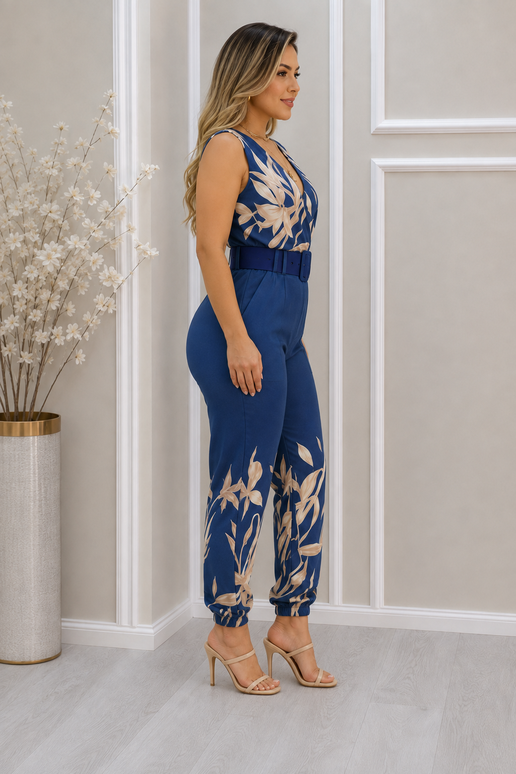 Stylish women's wide-leg jumpsuit featuring a vibrant floral print and wrap front, ideal for casual or party wear.