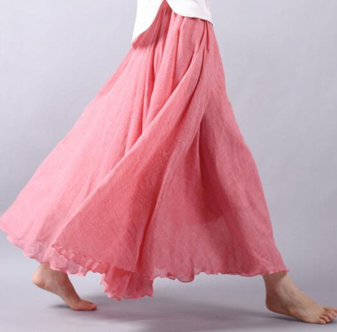Women's long A-line maxi skirt, ideal for vacation wear & casual chic. Flowing fabric & elastic waist.