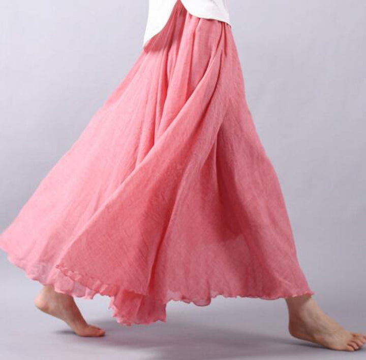 Women's long A-line maxi skirt, ideal for vacation wear & casual chic. Flowing fabric & elastic waist.