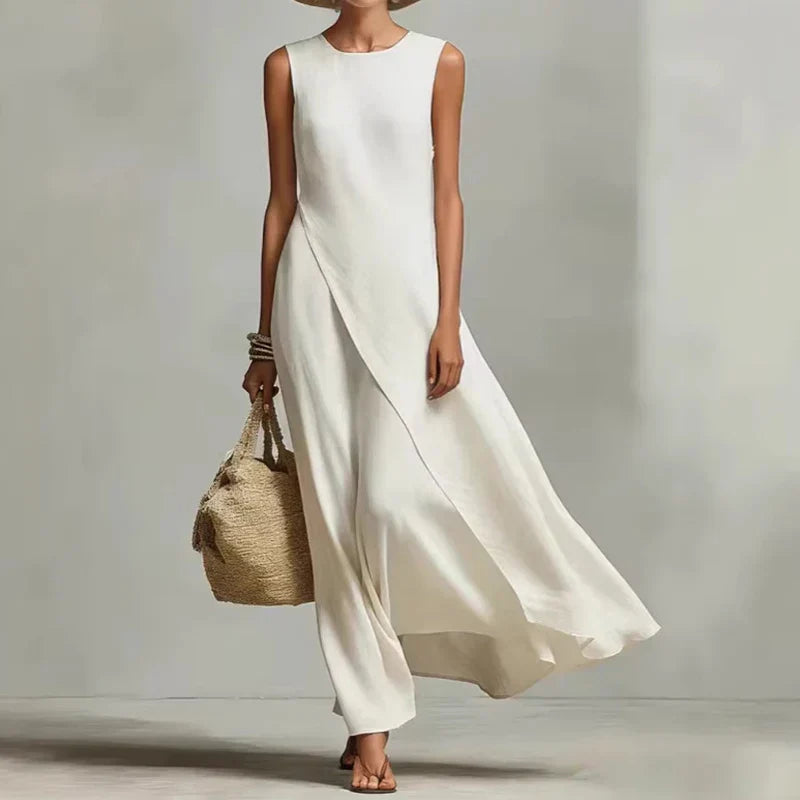 Sleeveless women's flowing asymmetrical maxi dress in a relaxed fit. Great for summer, casual or holiday wear.