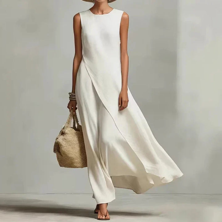 Sleeveless women's flowing asymmetrical maxi dress in a relaxed fit. Great for summer, casual or holiday wear.