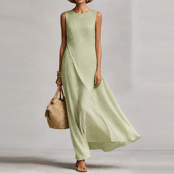 Stylish women's sleeveless summer maxi dress featuring a unique flowing asymmetrical hem and relaxed comfort.