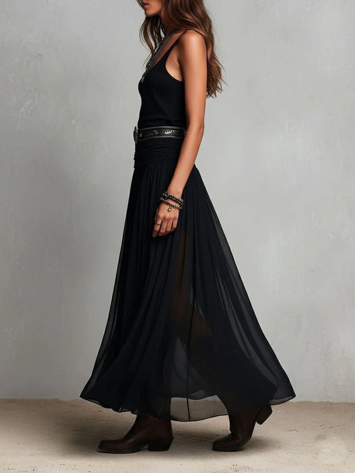 Women's V-neck sleeveless maxi dress in a flowing bohemian style, accented with a fashionable Western belt.