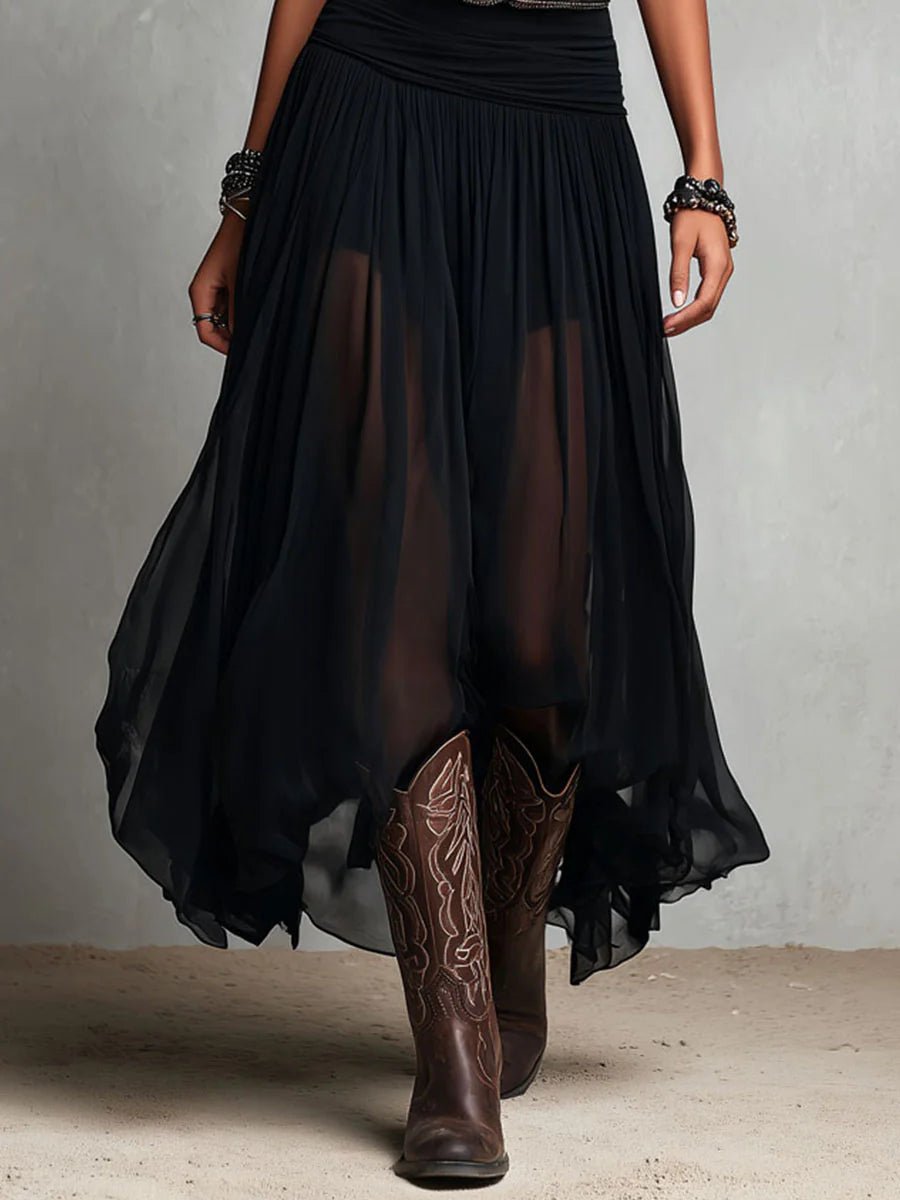 Women's apparel: a flowing boho maxi dress with V-neck, sleeveless cut, and Western belt for festival style.