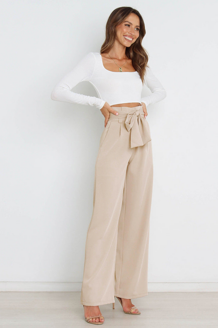 Breezy wide-leg linen trousers, perfect for warm weather.