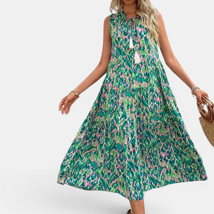 Women's flowing sleeveless boho midi dress, perfect for summer, beach, or casual elegant wear.