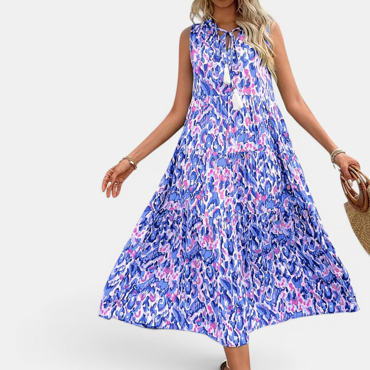 Women's elegant sleeveless midi dress, flowing boho design, perfect for summer evenings.