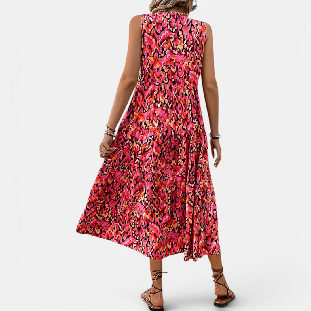 Women's flowing sleeveless V-neck midi dress, boho-inspired, ideal for summer adventures.