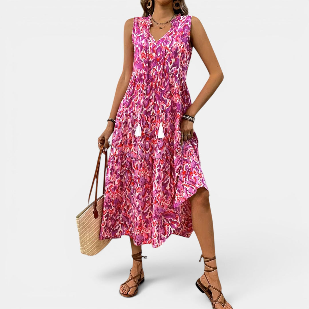 Women's flowing sleeveless boho midi dress, with a flattering V-neck, perfect for summer.