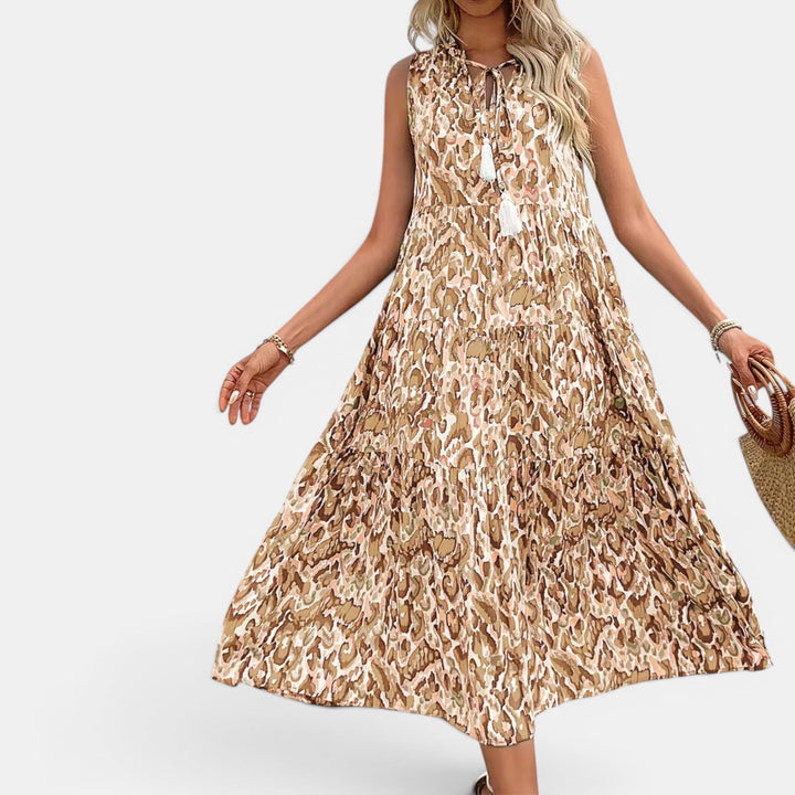 Fashionable women's sleeveless midi dress, flowy boho design, perfect for summer beach outfits.
