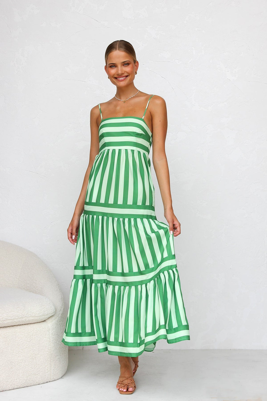 Women's flowing striped tiered maxi dress, perfect for summer casual wear.