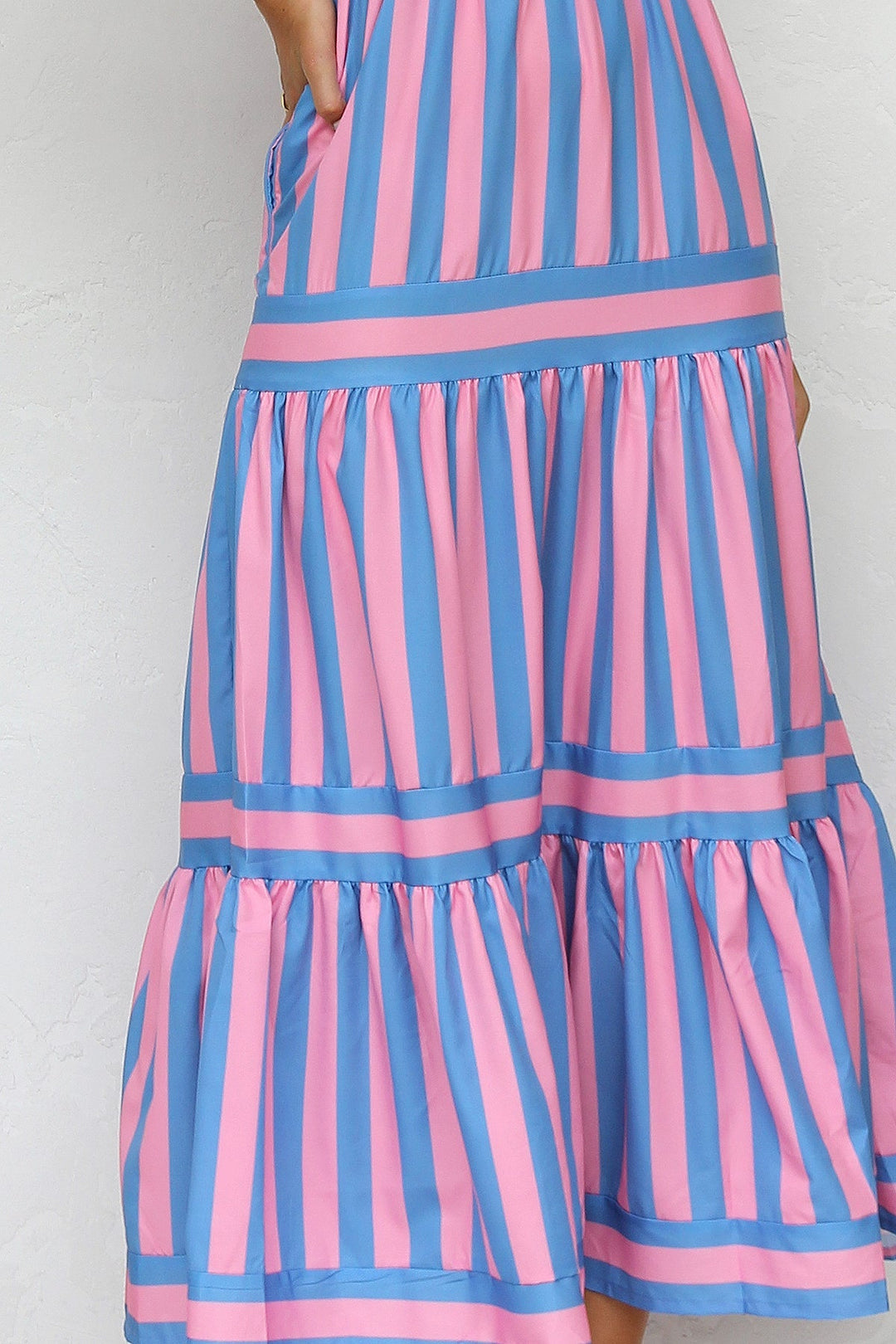 Elegant women's summer maxi dress with a flowing striped pattern and tiered skirt.