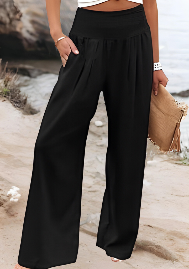 Casual women's wide-leg pants in a light, flowing fabric, perfect for beach outfits and warm weather fashion.